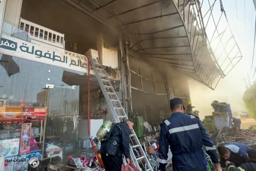 بالصور: إخماد حريق اندلع داخل مجمع تجاري وسط كربلاء