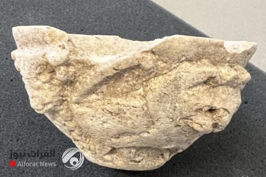 Small limestone vase with a relief decoration depicting a lion attacking a bull, repeated twice